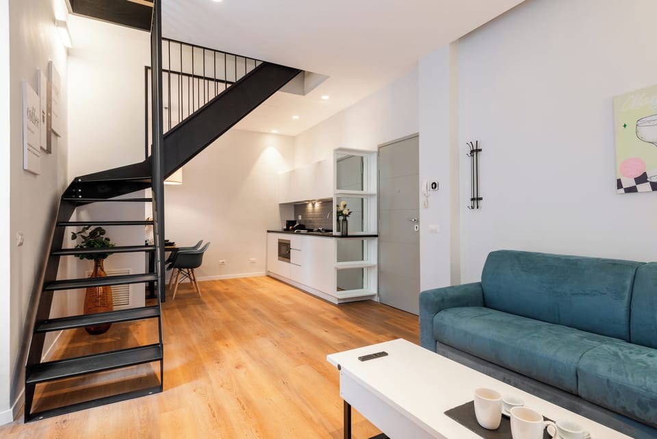 Loft, City View | Living area | TV