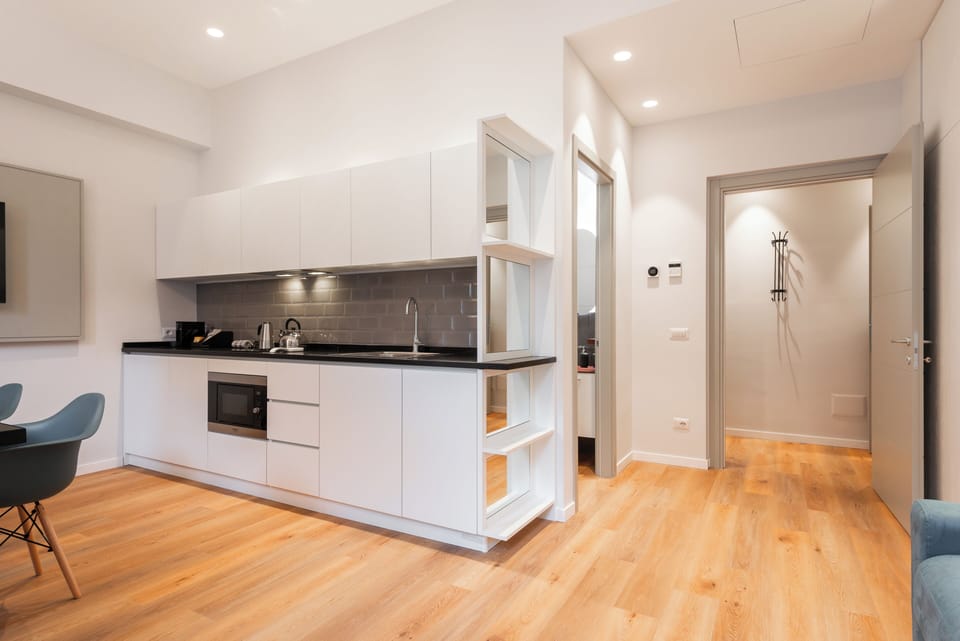 Deluxe Apartment, Courtyard View | Living area | TV