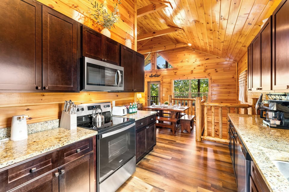 [Kitchen] Stainless steel appliances and granite countertops with plenty of cabinet space.