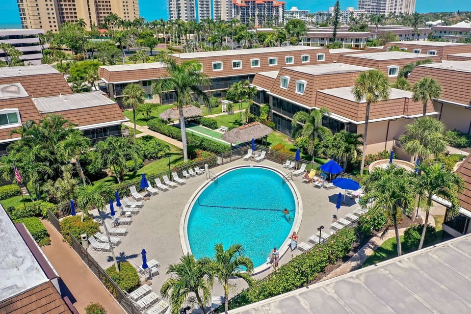 Quiet garden-style  pool surrounded by tropical landscaping in Island Manor