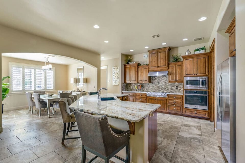Enjoy cooking and socializing in our spacious kitchen with a large island, modern appliances, and stylish design.