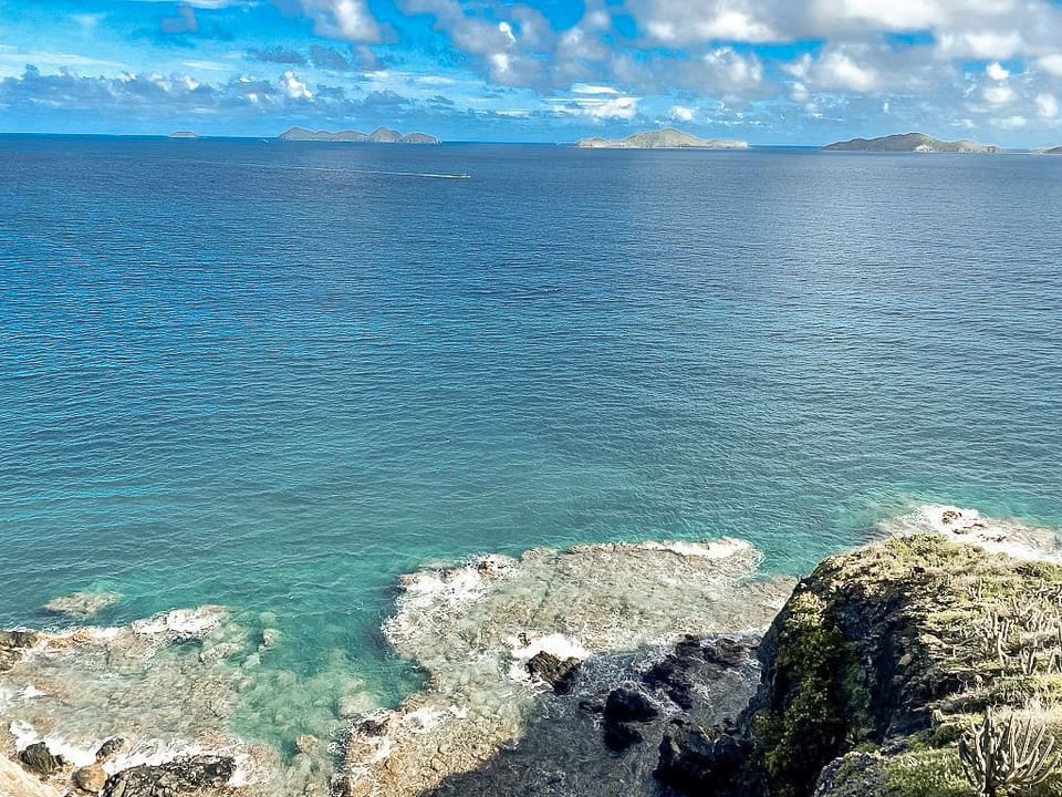 Sweeping ocean views over rocky cliffs and turquoise waters—pure tropical serenity.