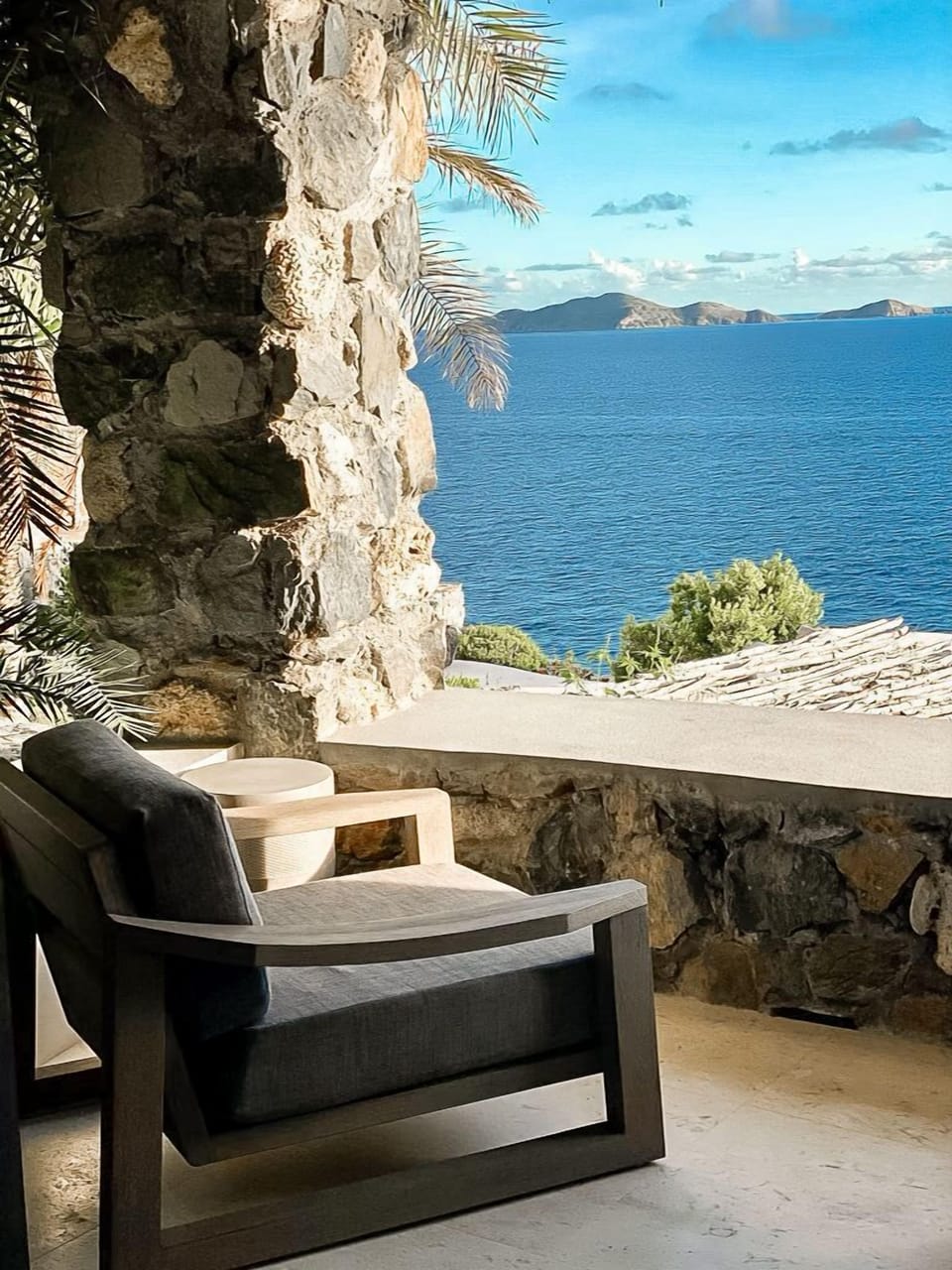 A corner of the stone deck lounge gives you access to panoramic sea views.