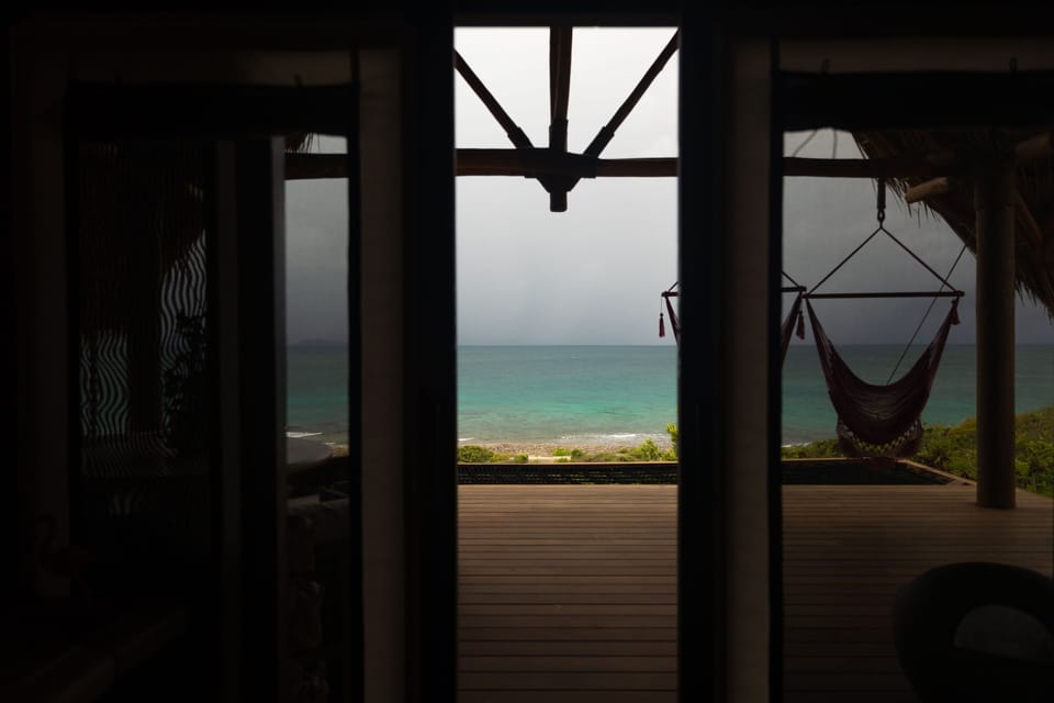 Embrace the serene blues of the Caribbean, just a step away from your private retreat.