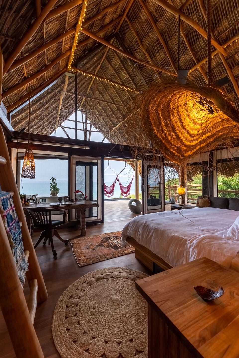 Awaken to breathtaking ocean views and the gentle sway of hammocks in your serene sanctuary.
