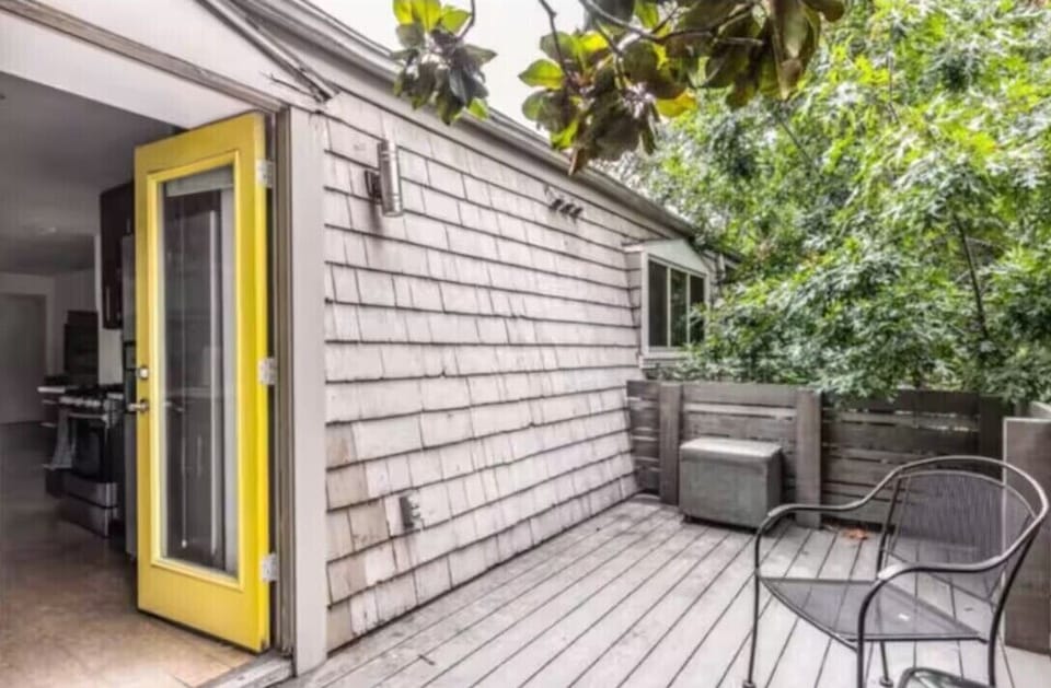 Relax, read, or chat in this inviting back patio.