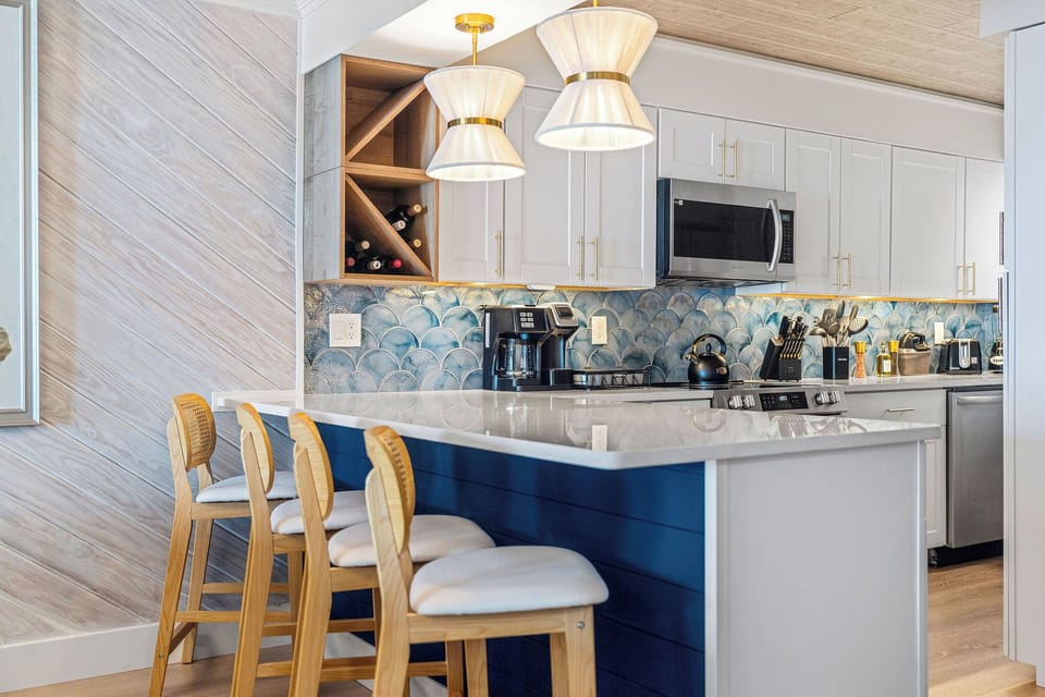 Stylish kitchen with modern appliances & bar seating