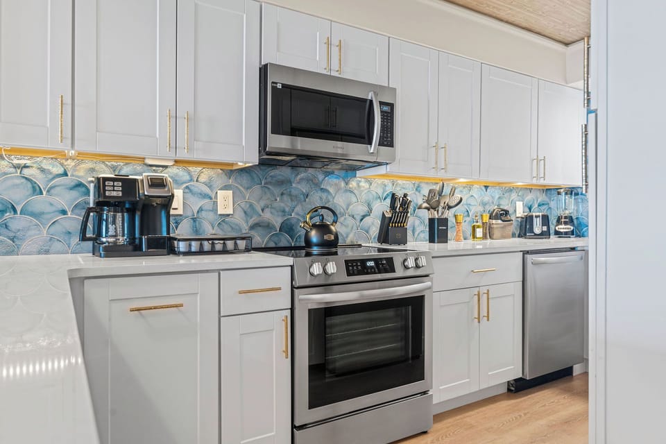 Spread out and actually cook — quartz counters and full-size stainless appliances make group dinners easy.