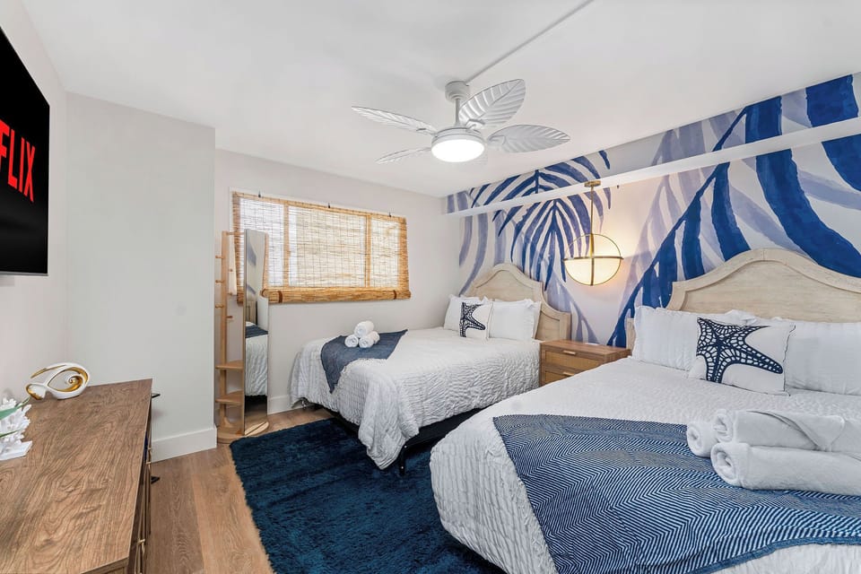 Give the kids or the extra crew their own space — this cheerful room sleeps two and keeps everyone happy.