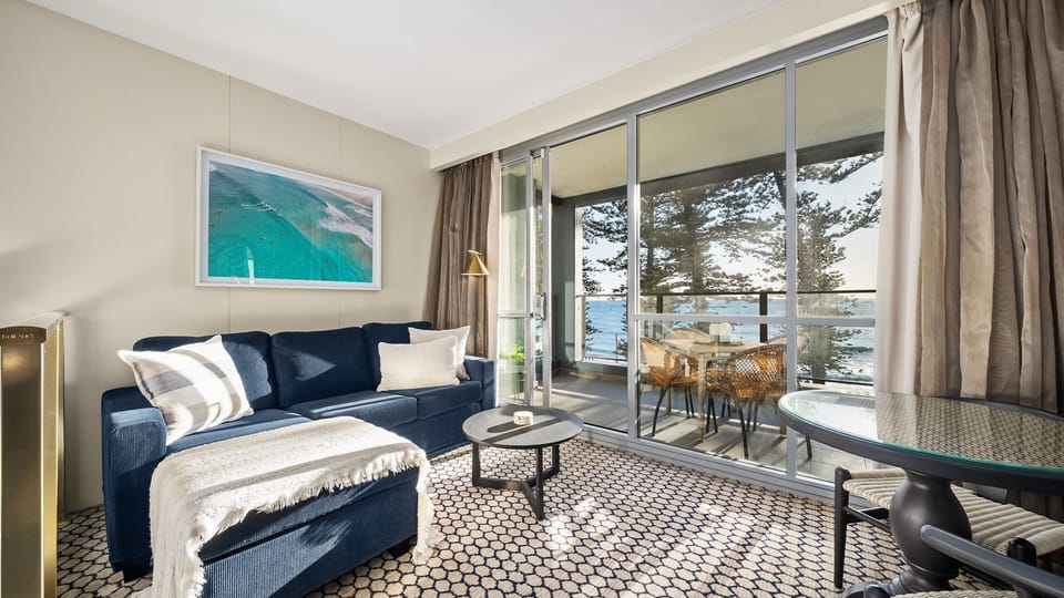 Open living area flowing seamlessly to the balcony with uninterrupted sea views.