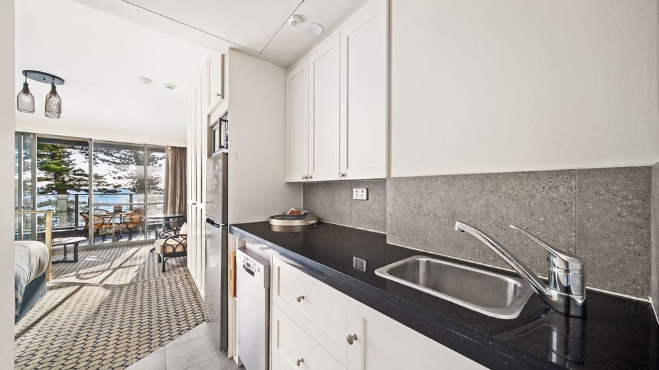 Fully equipped kitchen with ample counter space for easy meal preparation. 