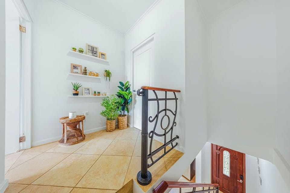 Enjoy the warm, inviting decor with lush greenery and attractive decorative shelving.