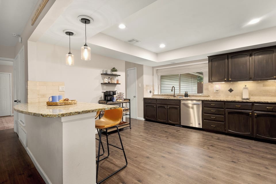A spacious kitchen island adds seating and prep space.