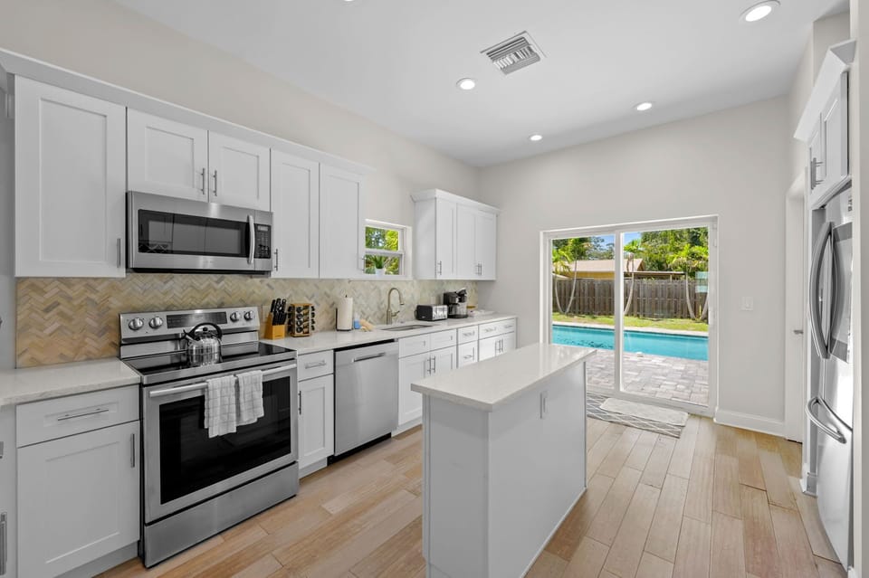 Cook up some memories (or just some snacks!) in this stylish and fully equipped kitchen. The best part? Instant access to poolside fun! 