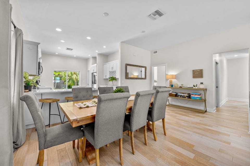 This lovely dining space offers a bright and welcoming atmosphere for enjoying meals together. 