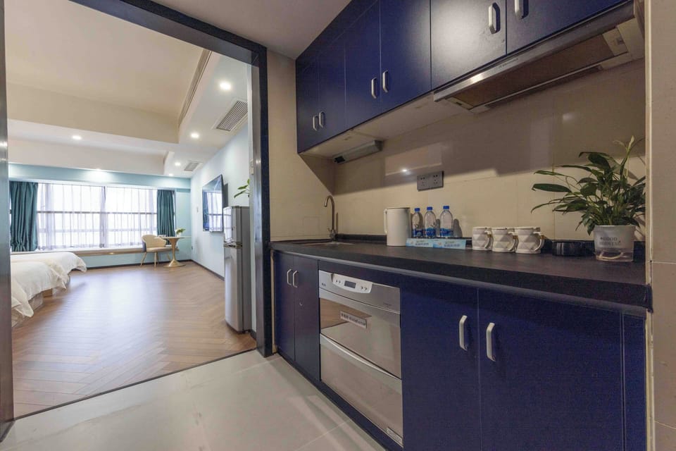 Luxury Triple Room, City View | Private kitchen | Mini-fridge, microwave, electric kettle, paper towels