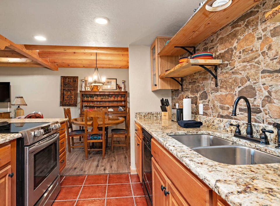 The galley kitchen includes full size appliances, a microwave, multiple coffee making options and everything you need to prepare a full meal.