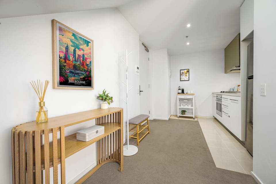 Welcome home: curated art, open-plan living in CBD Free Tram Zone.
