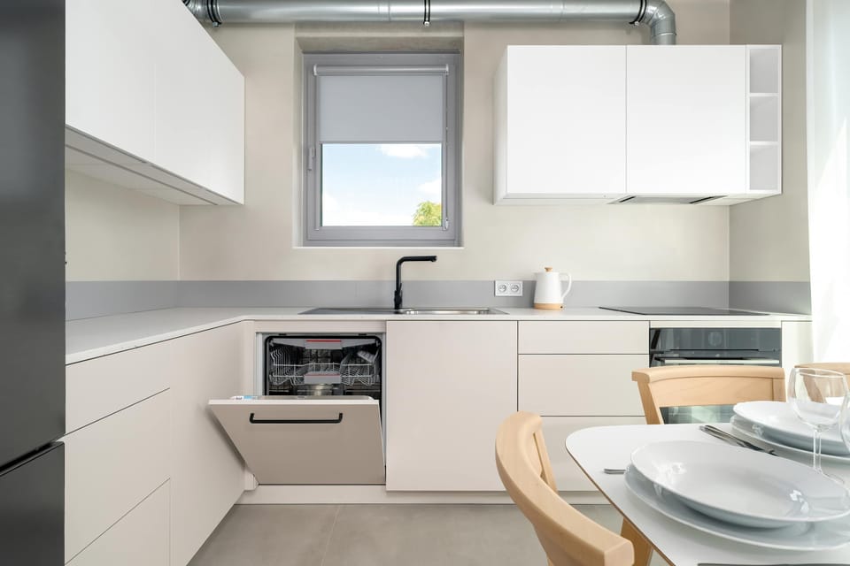 The modern kitchen with full equipment offers convenience for preparing your favorite meals.