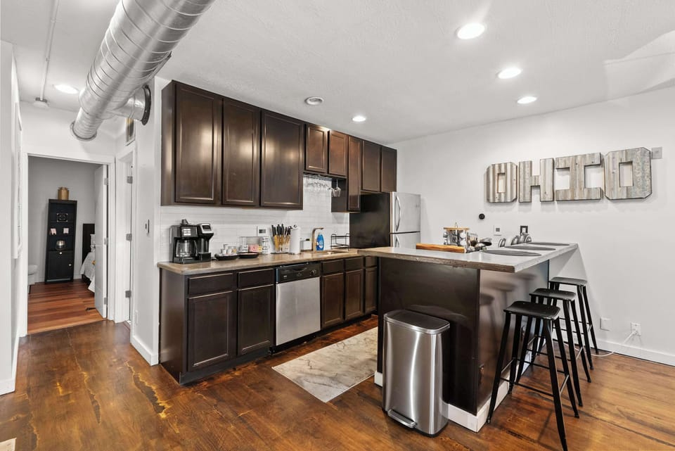 The sleek, open kitchen offers ample space & every home comfort​