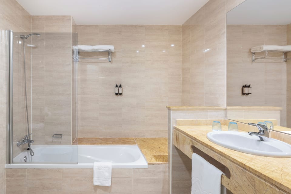 Combined shower/tub, eco-friendly toiletries, hair dryer, bathrobes