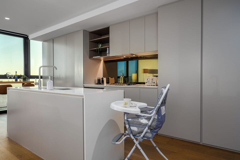 High chair & children’s dinnerware in full kitchen