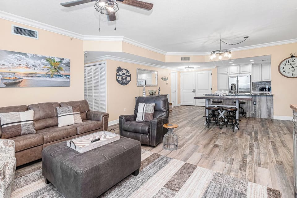 Step into your spacious coastal retreat where comfort meets style. Relax in plush leather seating while enjoying the open-concept design that flows seamlessly into your fully equipped kitchen.