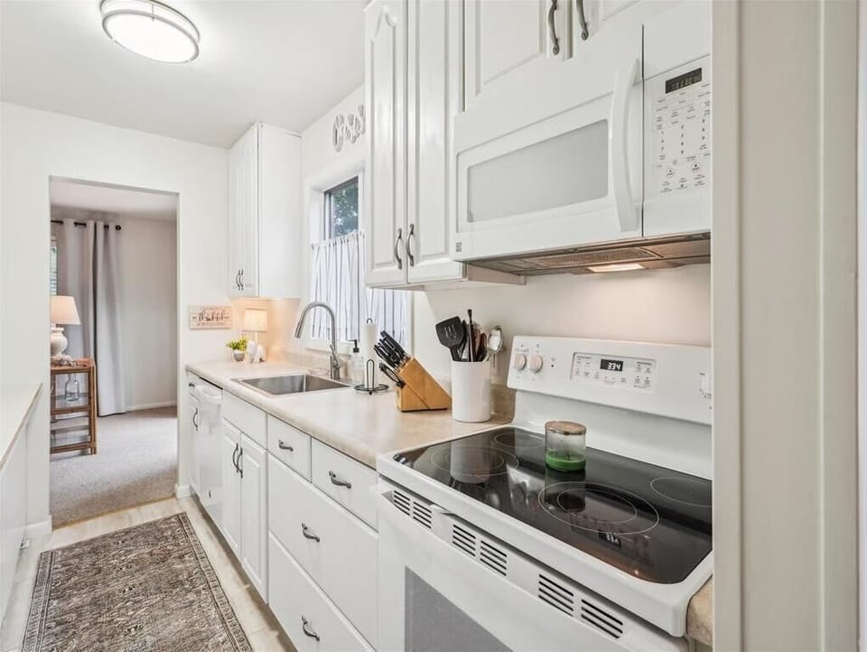 Fully equipped kitchen with dishwasher, stove, and microwave—cook just like at home.