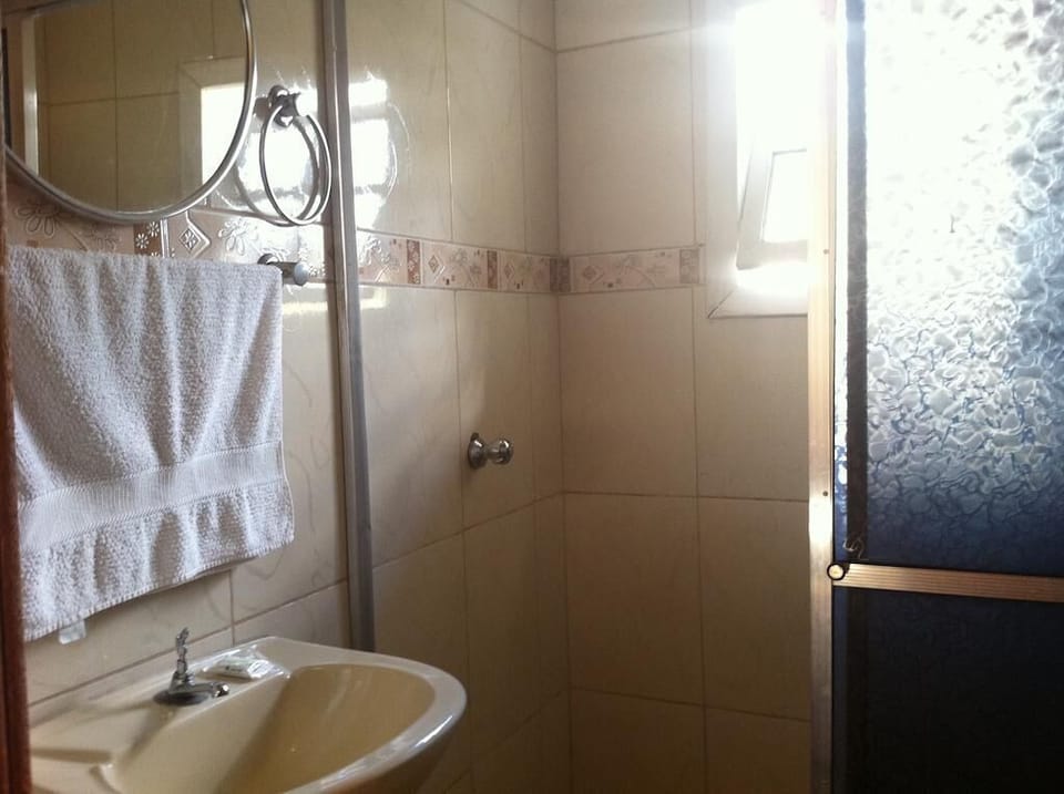 Basic Double Room | Bathroom | Shower, towels, soap, toilet paper
