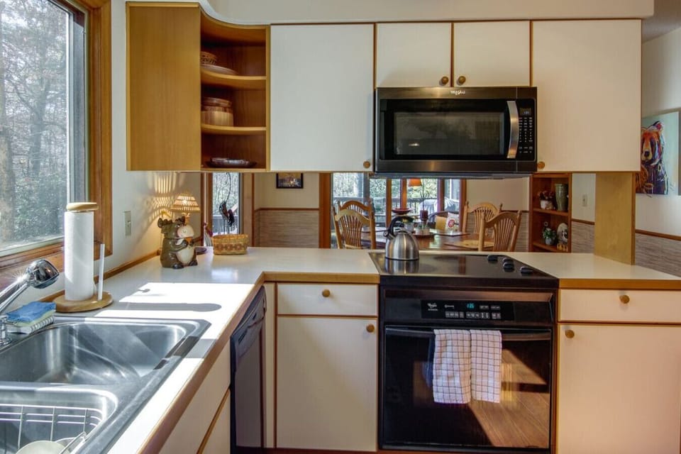 Kitchen | Bright & Functional | Black Appliances | Dining Area | Cozy Table & Mountain Views