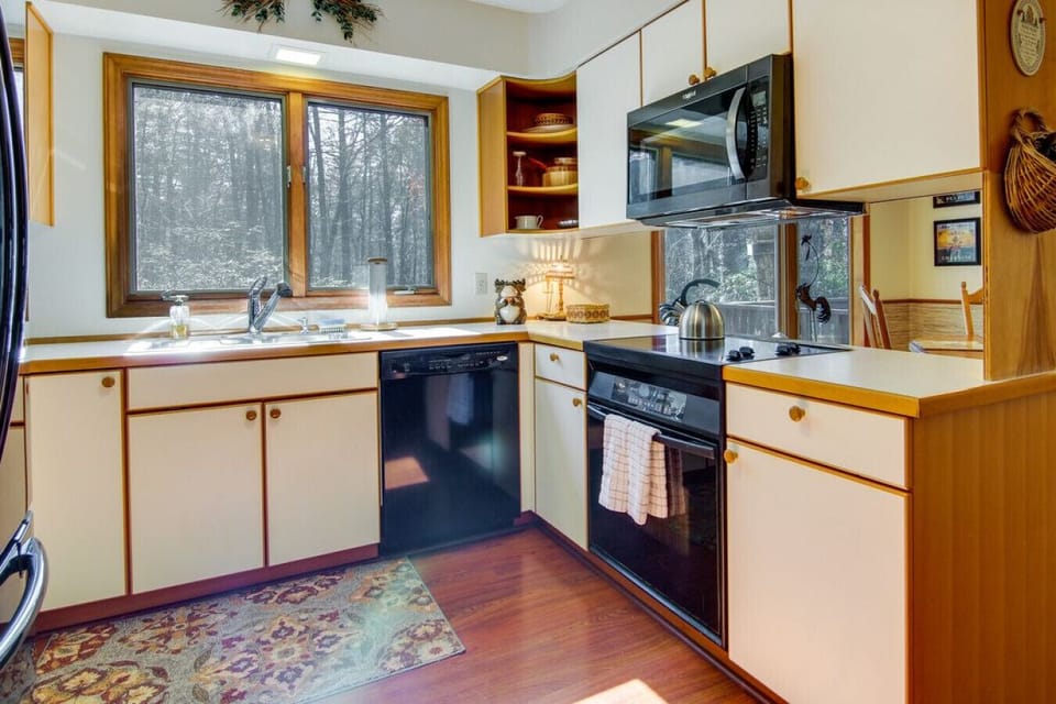 Kitchen | Bright & Functional | Black Appliances | Dining Area | Cozy Table & Mountain Views