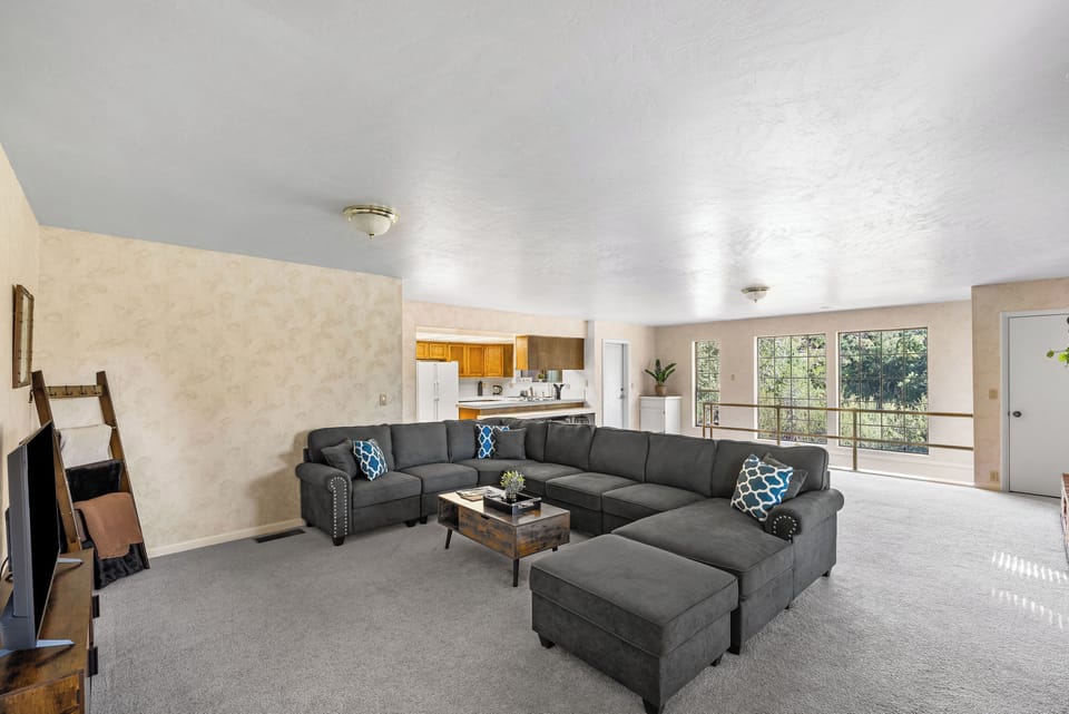 Living room with smart Tv, wifi, and a huge couch