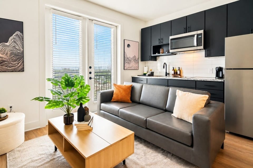 Relax in a bright and welcoming living space with comfortable seating, fast WiFi and a Smart TV after a day exploring the city.