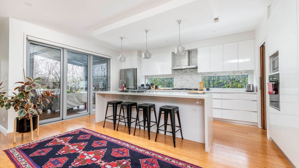 Bright kitchen with ample storage and bench space