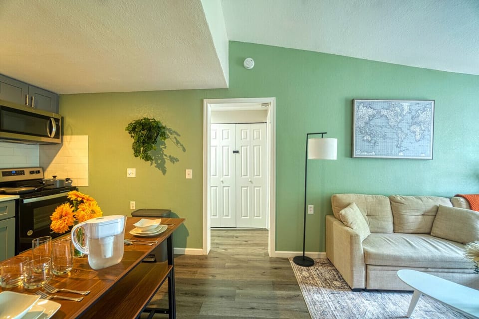 Spacious layout featuring a cozy living area, dining table, and fully equipped kitchen