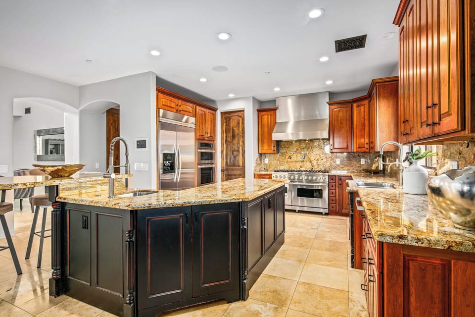 Kitchen with Gas Range, Island, and Fully Stocked Kitchen Utensils