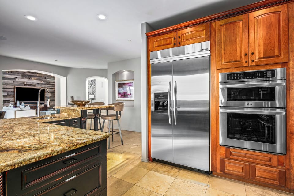 Kitchen with Large Refrigerator, Two Ovens, and Island
