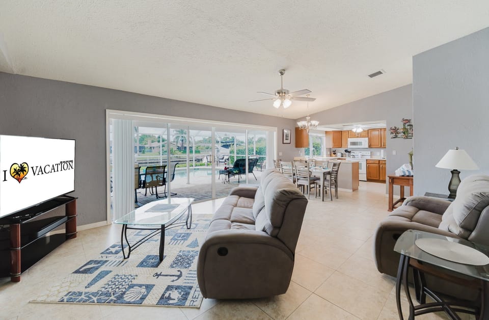 The open floor plan means everyone can be together! The living room features recliners