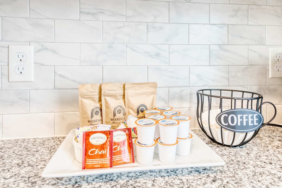 Dedicated coffee station with Keurig & drip brewer, mugs, and supplies to start your day right.