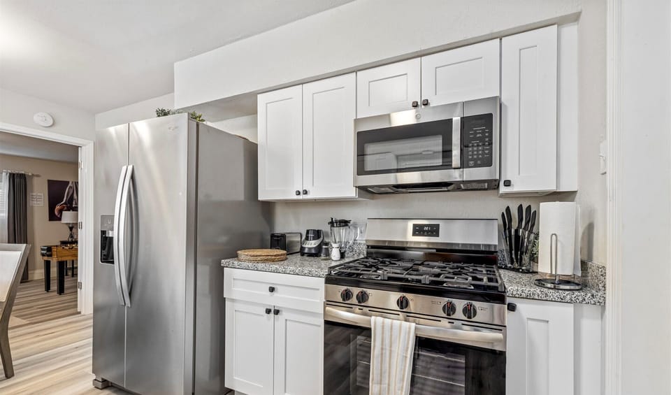Stainless steel appliances Fridge dispenses water and ice.