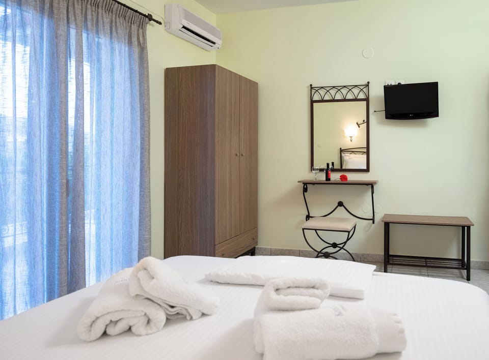 Deluxe Double Room, Balcony, Pool View | In-room safe, blackout drapes, iron/ironing board, free WiFi