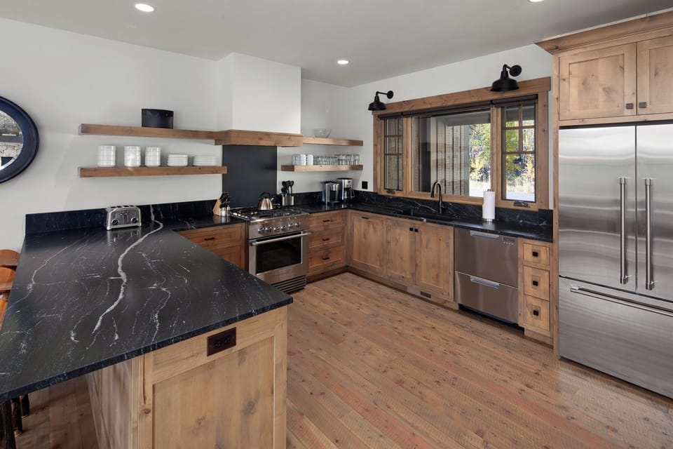 Cook effortlessly in a chef-ready kitchen with sleek stone counters.