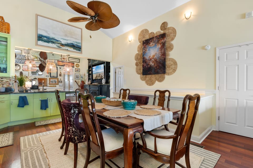 Gather around your elegant dining table where tropical breezes from the palm ceiling fan enhance memorable meals together.