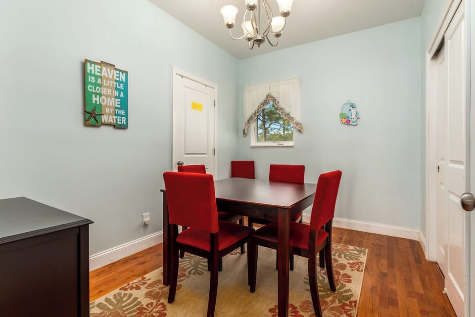 The house has a small table designated for additional seating and for game nights.