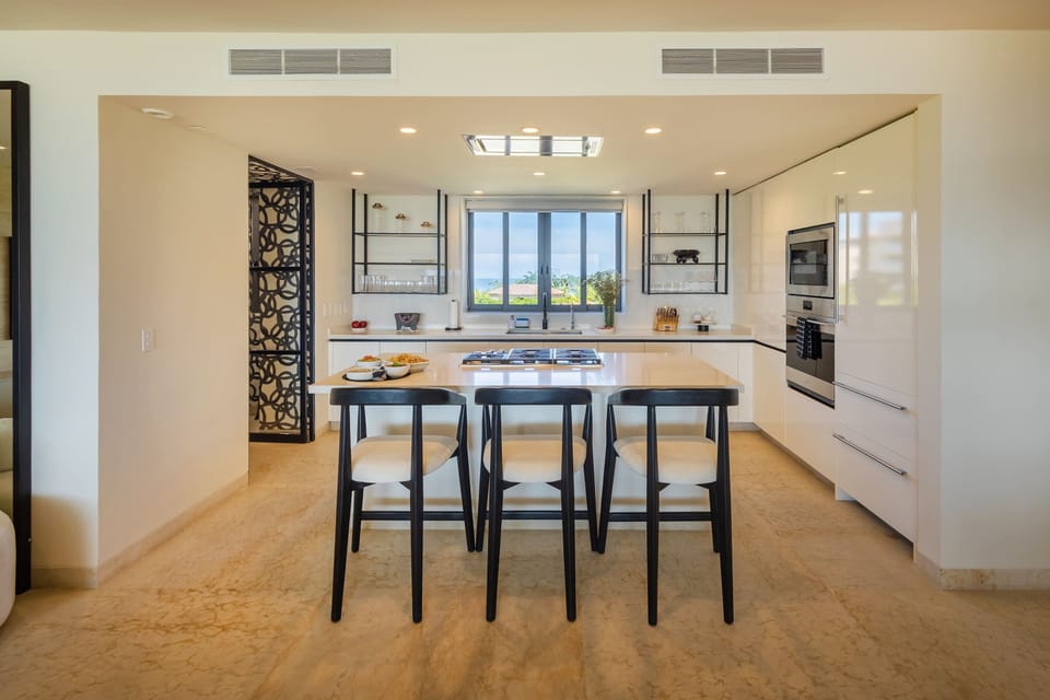 Stylish open-plan kitchen, watch the cook prepare breakfast for you