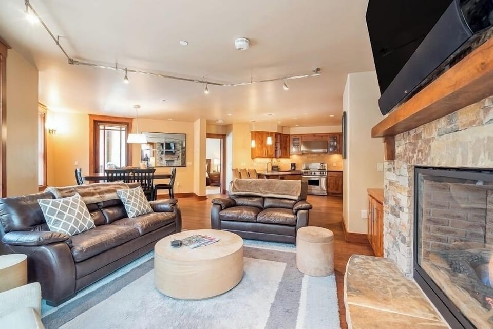 Living Room - Spacious, cozy, open-concept living area with a gas fireplace