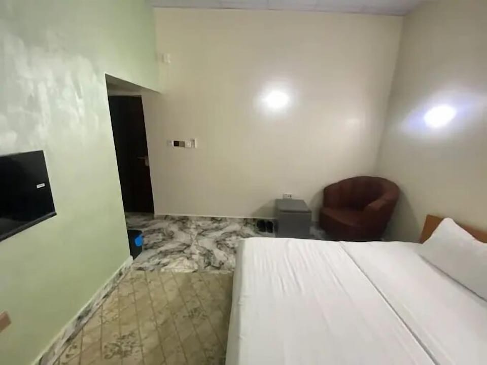 Family Apartment, Balcony, City View | In-room safe, desk, laptop workspace, blackout drapes