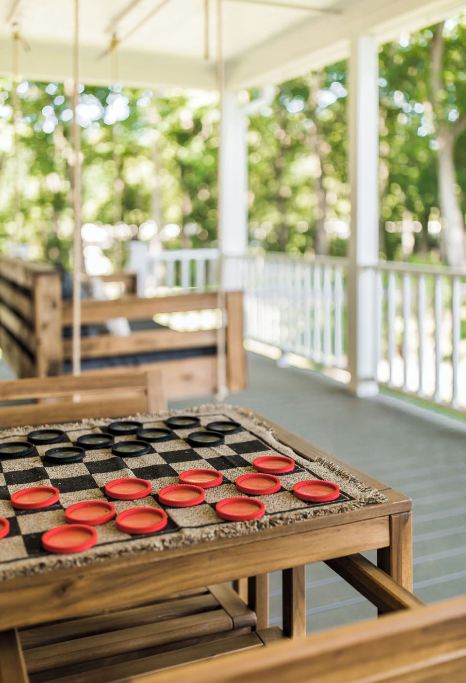 Checkers table on the front porch (tic tac toe on the opposite side) 