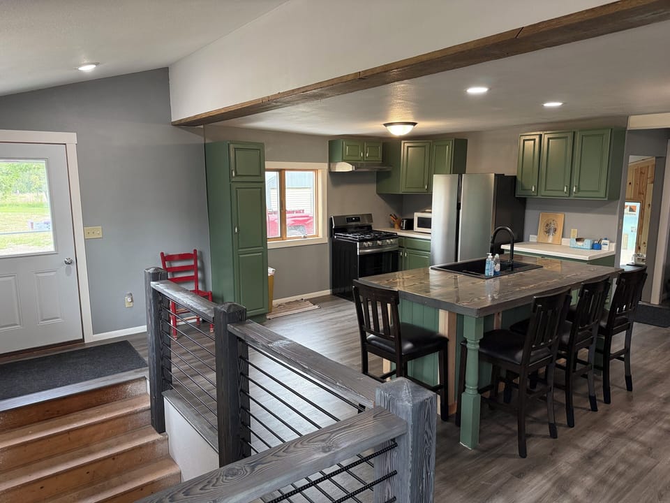 Front door, kitchen, and dining room area.