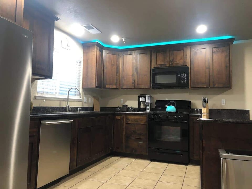 Kitchen with view out window of front yard.